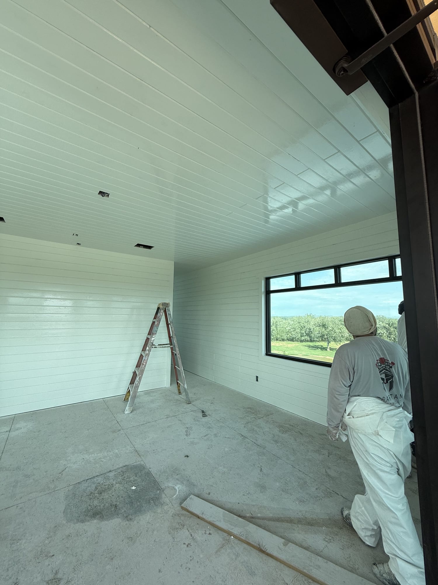 Same room with walls and ceiling finished in clean white, Spartan Painting