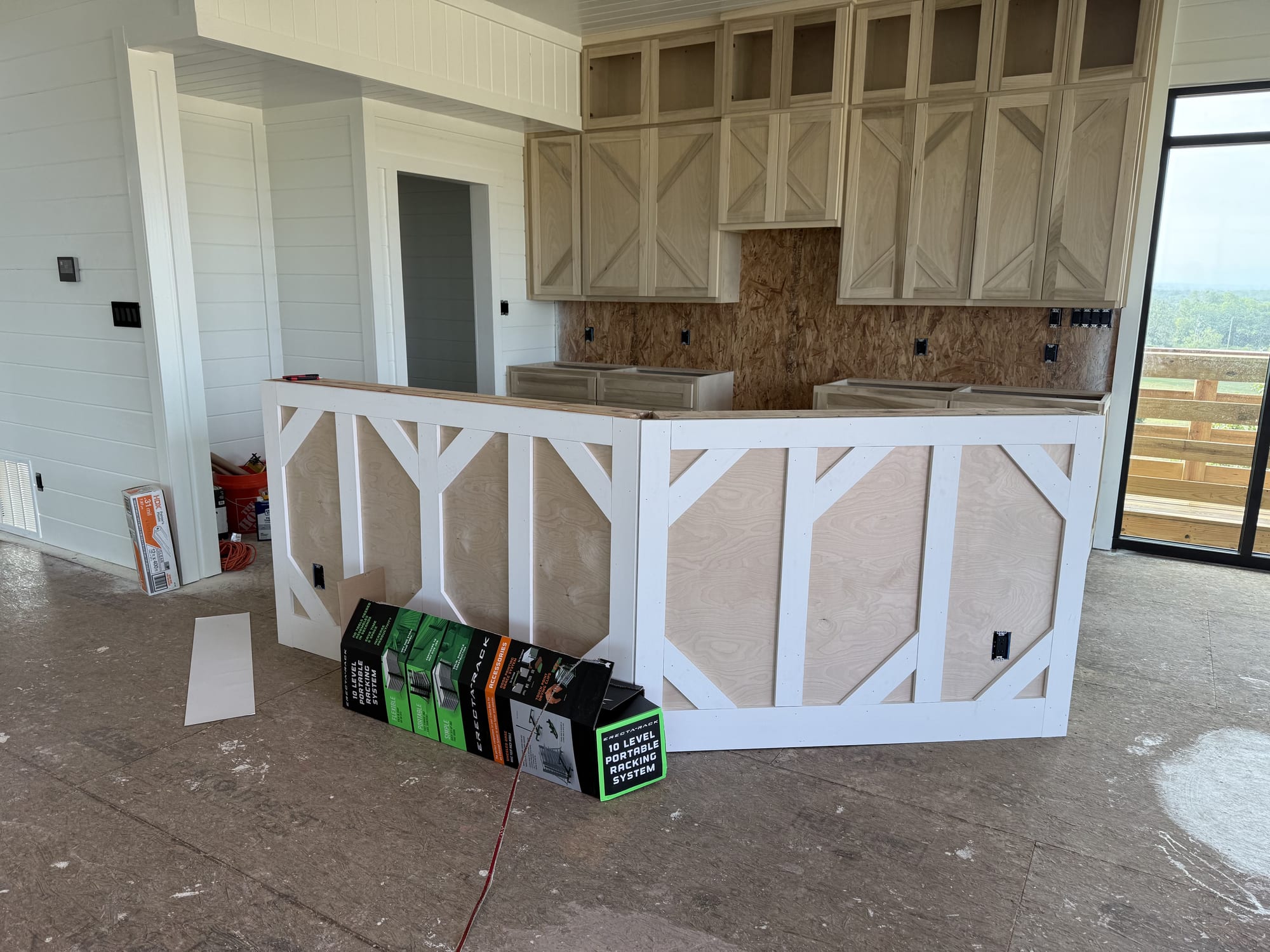 Unfinished kitchen cabinets before priming and painting